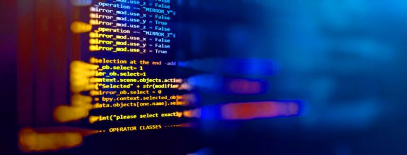 Partially obscured computer code on a screen, lit up in orange and blue