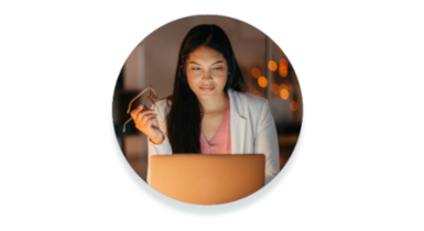 A lady looks at a laptop screen