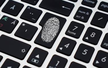 A clear fingerprint on a keyboard return key
